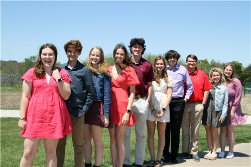 11 SHHS students smiling outside at the SHEF Golf Tournament