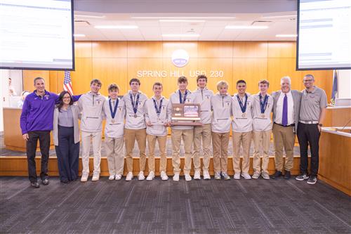Spring hill cross country team with its state title award