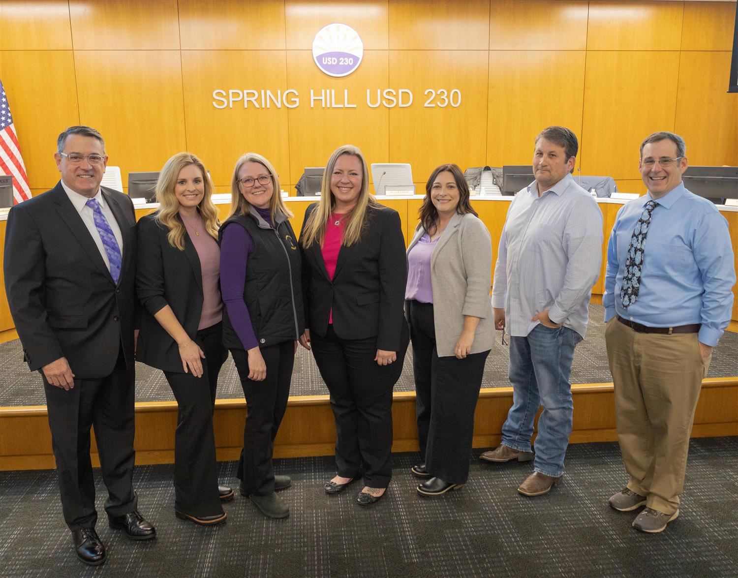 Seven BOE members smiling in a group