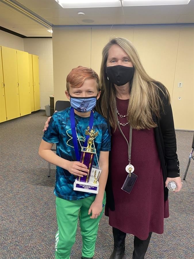  2021 Spelling Bee Winner, Liam Daniels, with principal, Mrs. Sly