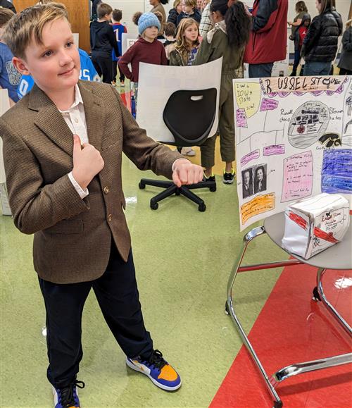 Student posing as Russell Stover during the 4th Grade Famous Kansan Wax Museum