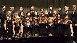SHHS students in the Madrigals choir smiling in a group